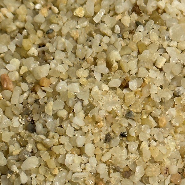 Close-up view of high-purity Industrial Silica grains, showcasing their fine texture and consistency.
