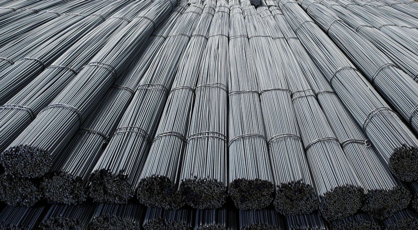 multiple stacks of steel rebar piled on each other macro view