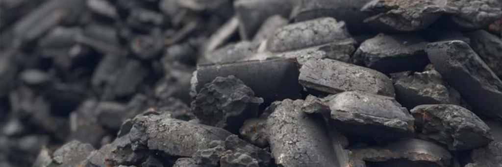 close up of a pile of hot briquetted iron