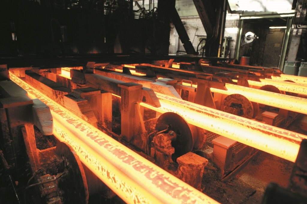 red glowing hot billets in a factory production line