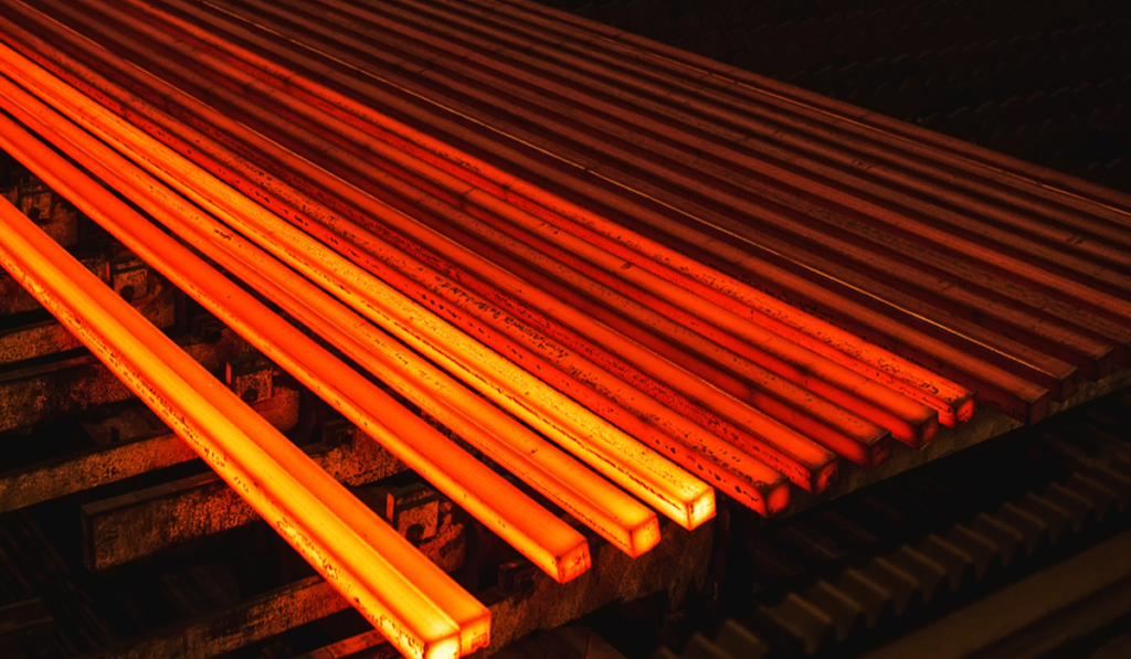 red glowing hot billets in a factory production line
