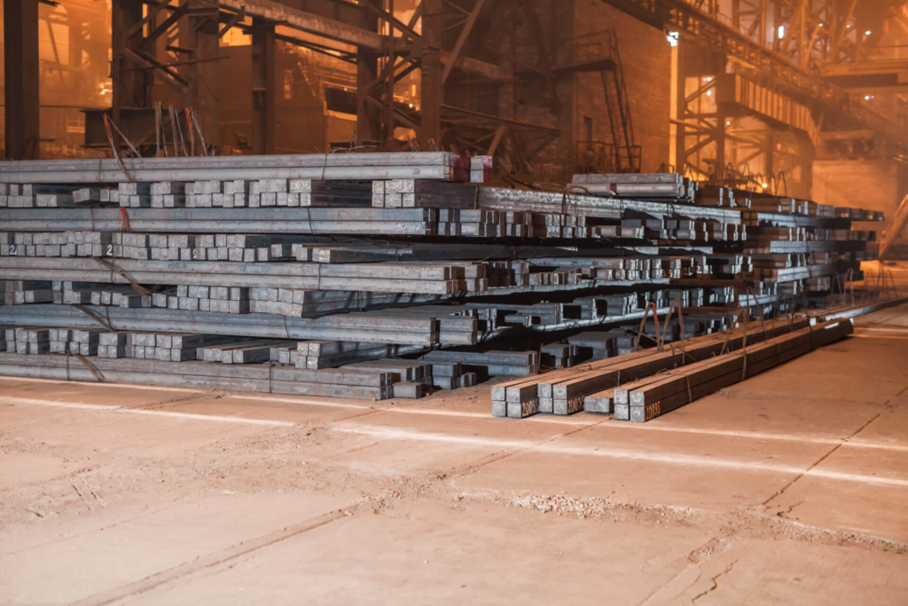 steel blooms stacked in storage