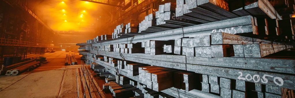 steel blooms stacked in a factory storage