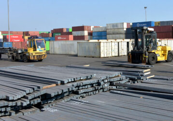 steel billets in a loading bay