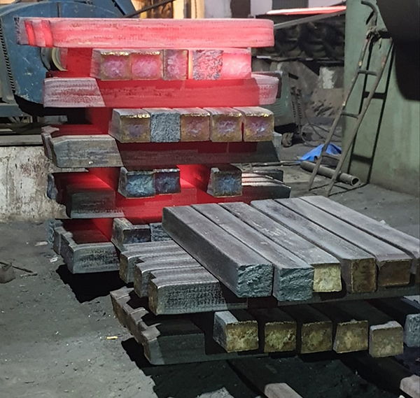 red hot billets stacked on top of each other