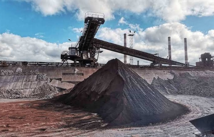 close up of a pile of black iron concentrate in a factory yard