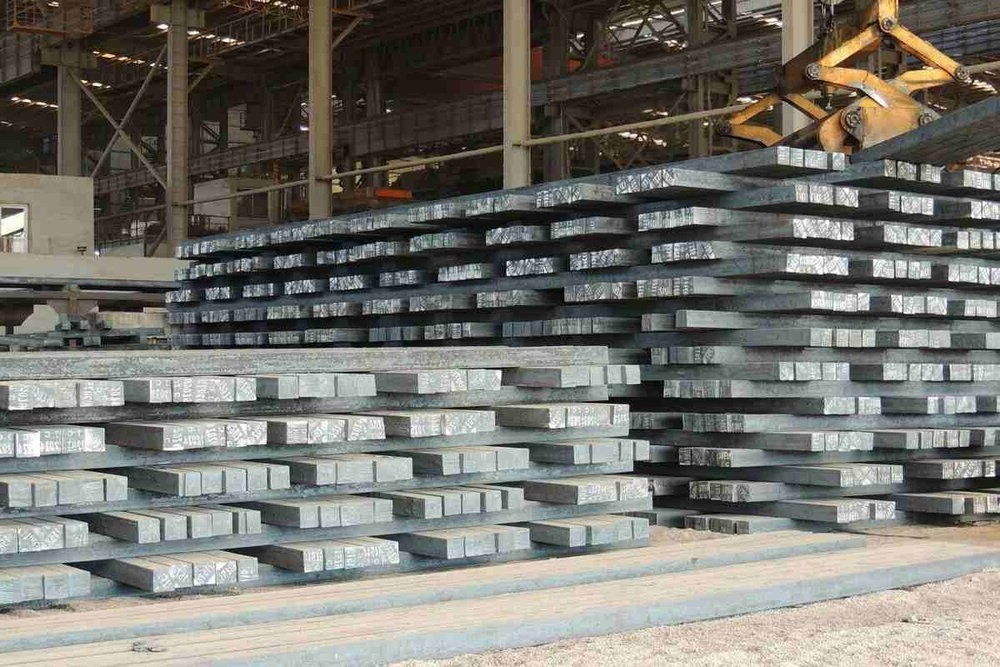 iron billets stacked in storage